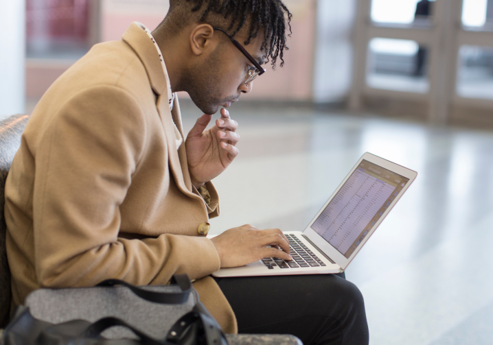 Person using laptop with FXTM webtrader